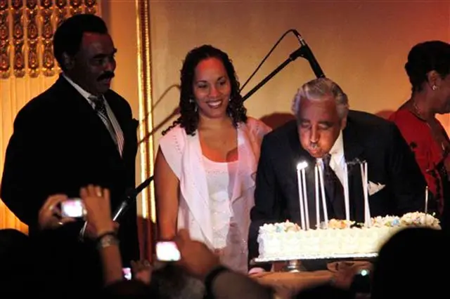 Rep. Charles Rangel blows out birthday candles with singer Chuck Jackson and daughter Alicia Rangel looking on